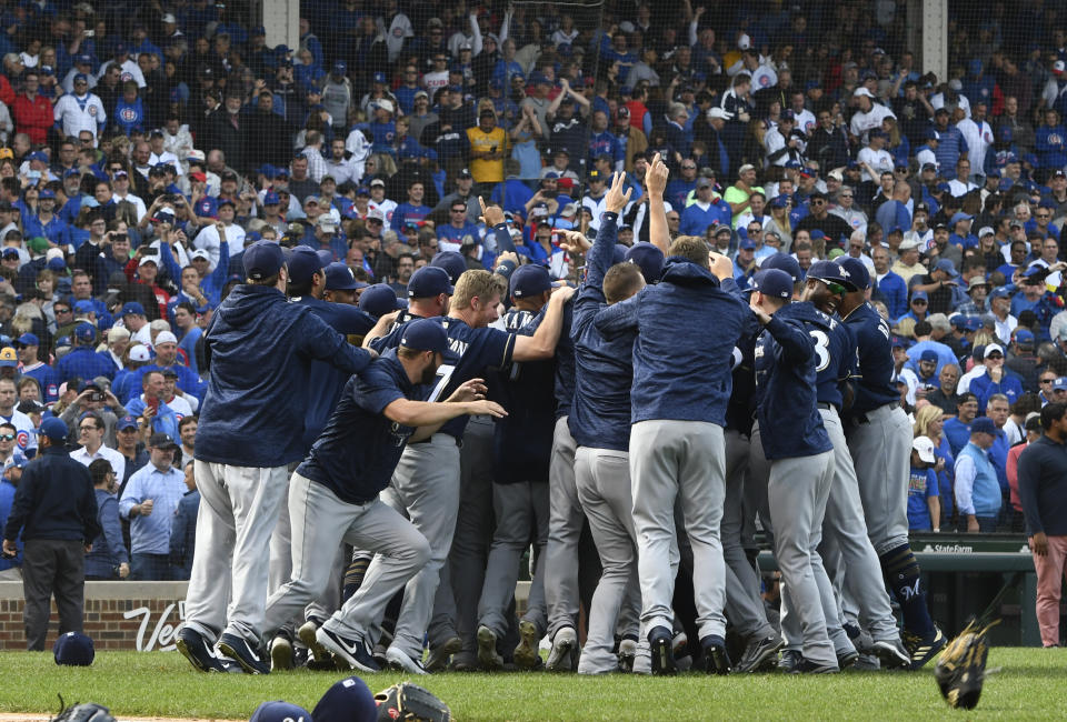 Milwaukee Brewers players celebrate after defeating the Chicago Cubs 3-1 at the end of a tiebreak baseball game on Monday, Oct. 1, 2018, in Chicago. (AP Photo/Matt Marton)