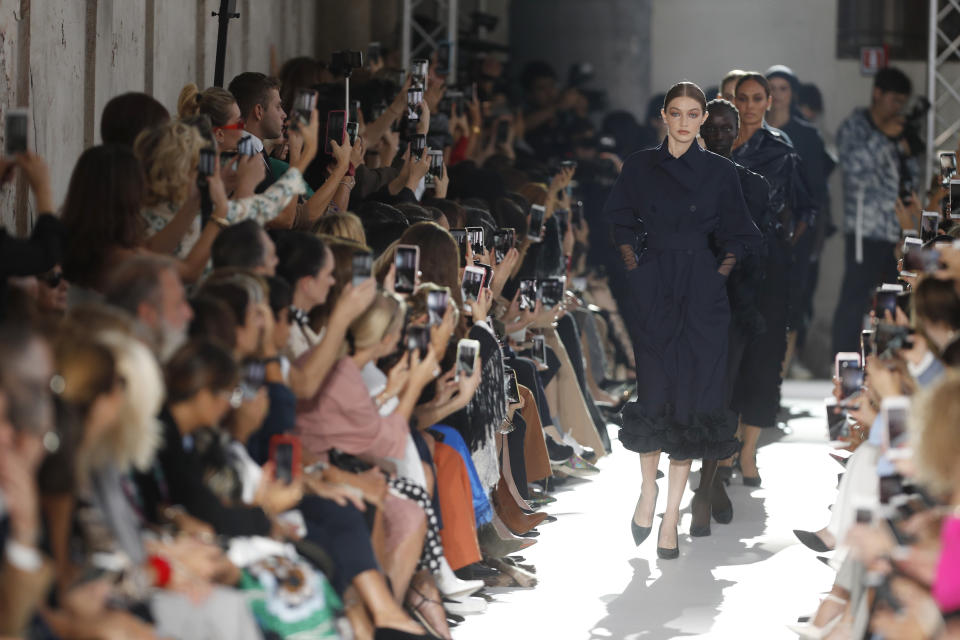 Model Gigi Hadid, front, leads other models as they wear creations as part of the Max Mara women's 2019 Spring-Summer collection, unveiled during the Fashion Week in Milan, Italy, Thursday, Sept. 20, 2018. (AP Photo/Antonio Calanni)