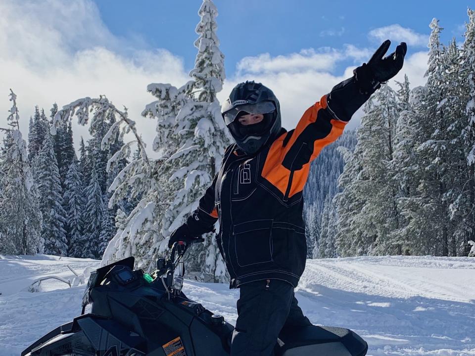 The author on a snowmobile in West Yellowstone