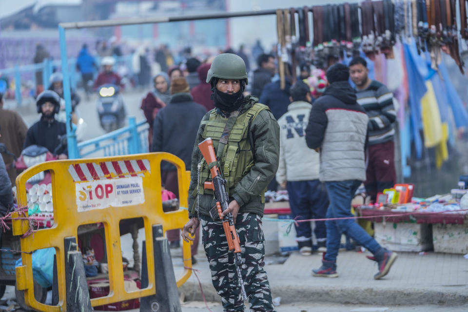 An Indian paramilitary soldier stands guard in Srinagar, Indian controlled Kashmir,Tuesday, Dec 23, 2023. Anger spread in some remote parts of Indian-controlled Kashmir after three civilians were killed while in army custody, officials and residents said Saturday. This comes two days after a militant ambush killed four soldiers. (AP Photo/Mukhtar Khan)