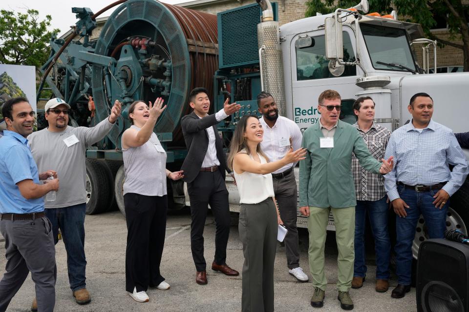 CEO and Co-Founder of Bedrock Energy Joselyn Lai, front center, and co-founder and chief technology officer Silviu Livescu, front right, gather at the unveiling of the company’s first geothermal project at the Penn Field business park Wednesday.