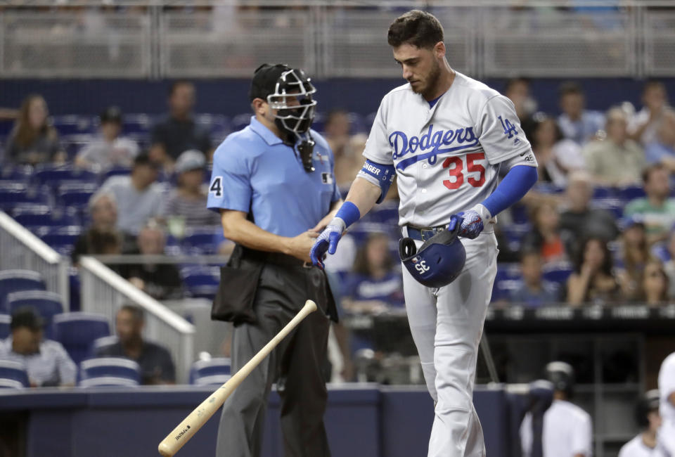 Los Angeles Dodgers' Cody Bellinger (35) tosses his bat after striking out during the first inning of the team's baseball game against the Miami Marlins, Tuesday, Aug. 13, 2019, in Miami. (AP Photo/Lynne Sladky)