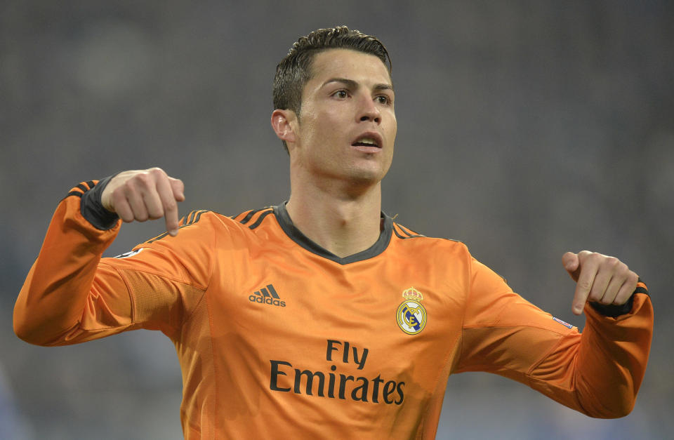 Real's Cristiano Ronaldo reacts after scoring during a Champions League round of sixteen, first leg soccer match between Schalke 04 and Real Madrid at the Veltins Arena in Gelsenkirchen, Germany, Wednesday Feb. 26, 2014. (AP Photo/Martin Meissner)