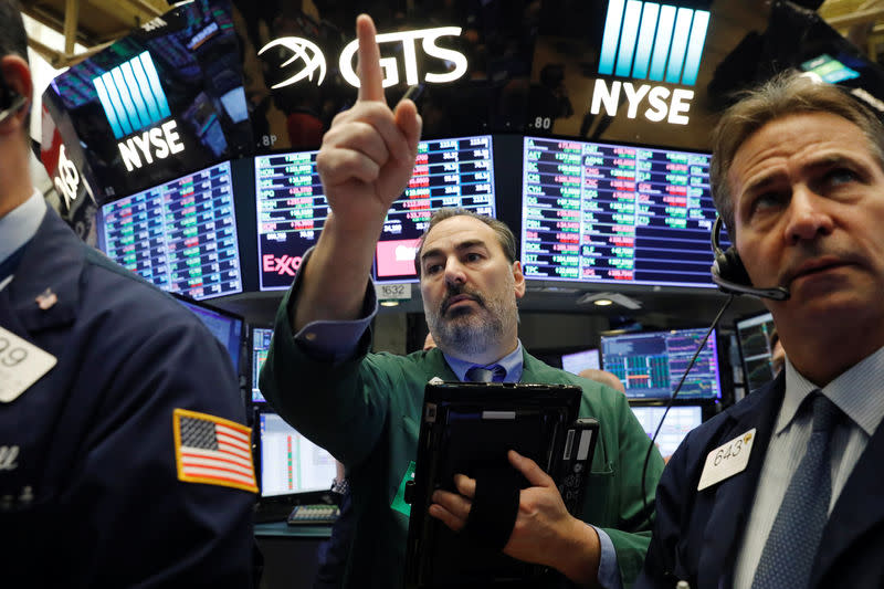 Traders work on the floor of the New York Stock Exchange shortly after the opening bell in New York, U.S., February 15, 2018. REUTERS/Lucas Jackson