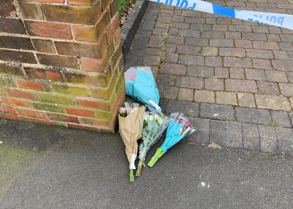 Flowers outside the house on Boundary Avenue in Rowley Regis, West Midlands, where a woman in her 80s died after being attacked by two escaped dogs. Picture date: Saturday April 3, 2021.