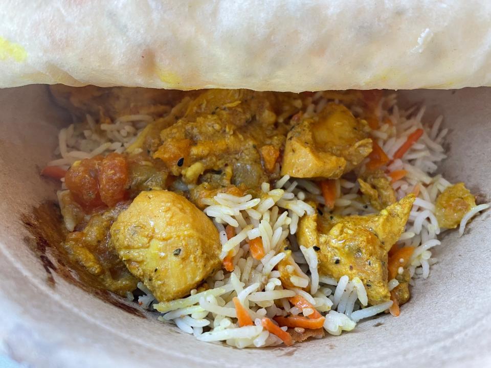 Rom’s Bowl at Rom's House in Marble City Market features a base of rice, a protein, a side salad, hot sauce and Afghan bread.