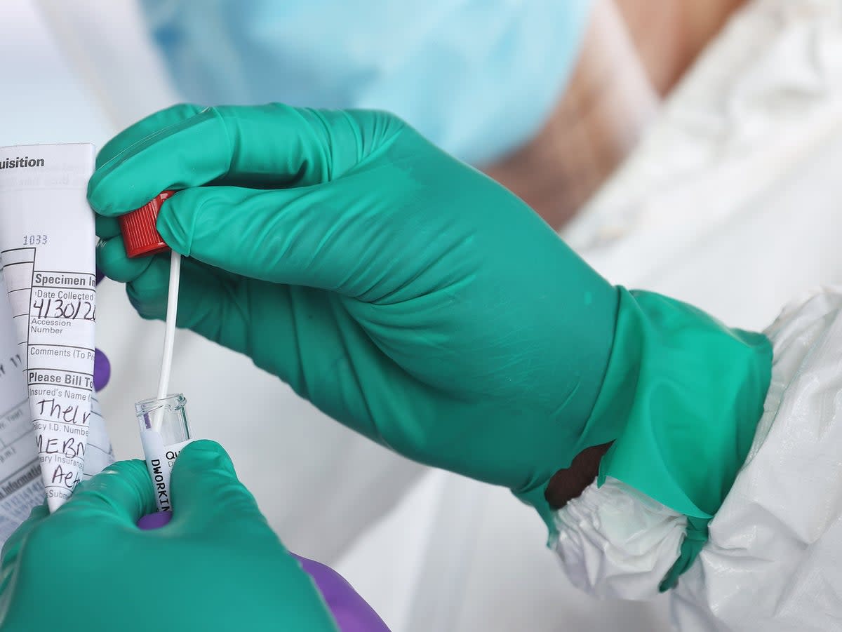 A Health Care Worker seals a coronavirus swab after testing at the Pro Health Urgent Care coronavirus testing site on April 30, 2020 in Wantagh, New York (Getty Images)