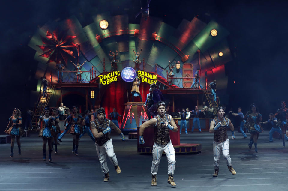 Ringling Bros. and Barnum & Bailey performers are seen during a show Saturday, Jan. 14, 2017, in Orlando, Fla. The Ringling Bros. and Barnum & Bailey Circus will end the "The Greatest Show on Earth" in May, following a 146-year run of performances. Kenneth Feld, the chairman and CEO of Feld Entertainment, which owns the circus, told The Associated Press, declining attendance combined with high operating costs are among the reasons for closing. (AP Photo/Chris O'Meara)