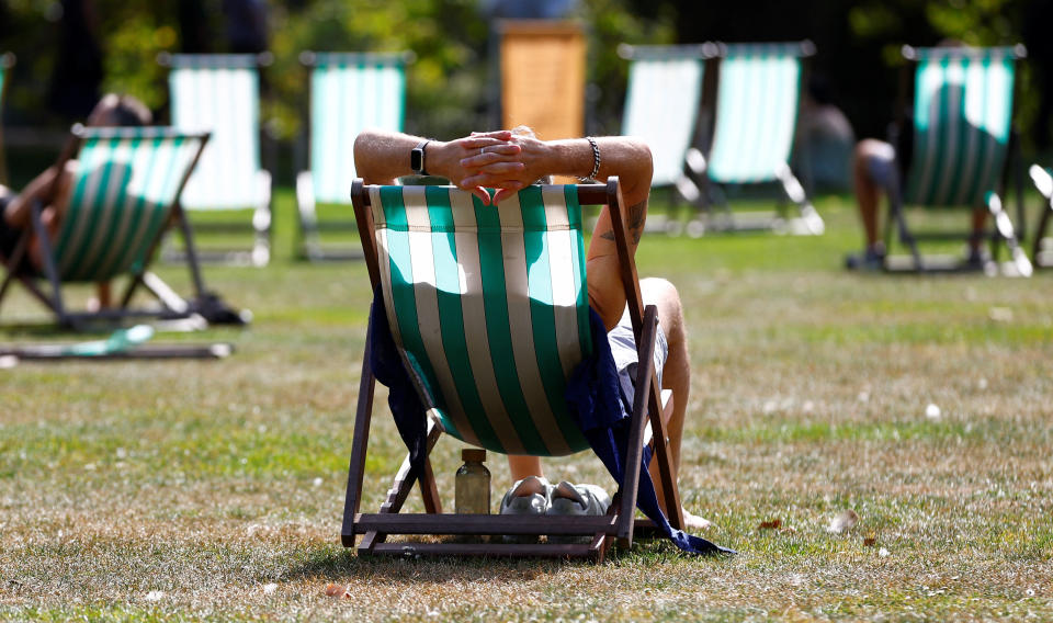 People relax in the late summer sun, in St James' Park, London, Britain, September 5, 2023.  REUTERS/Peter Nicholls