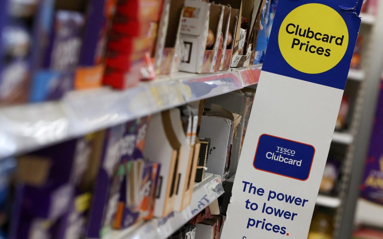 Clubcard branding is seen inside a branch of a Tesco Extra Supermarket in London - Paul Childs / Reuters