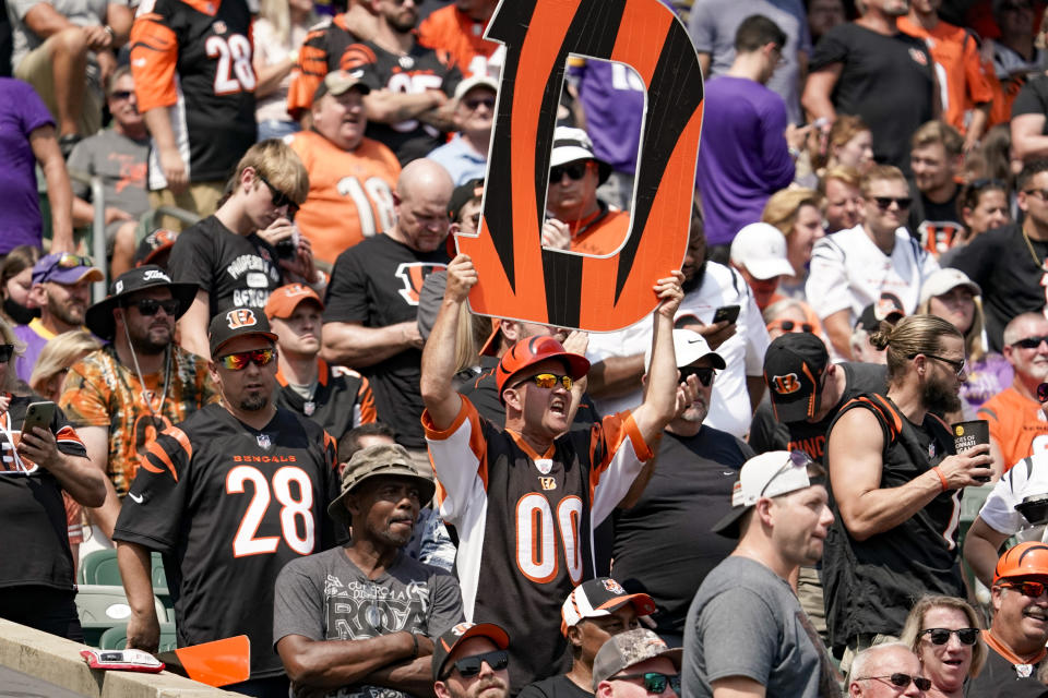 Cincinnati Bengals fans cheer during the first half of an NFL football game against the Minnesota Vikings, Sunday, Sept. 12, 2021, in Cincinnati. (AP Photo/Jeff Dean)