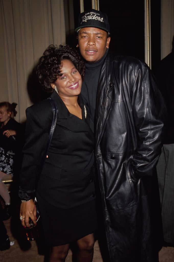 Michel'le and Dr Dre standing together