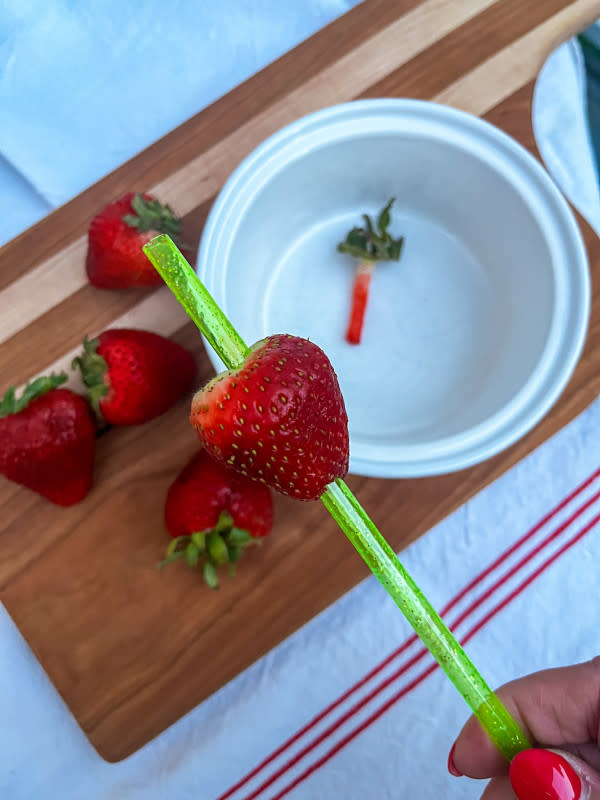 Hulling strawberries with a reusable plastic straw<p>Courtesy of Jessica Wrubel</p>