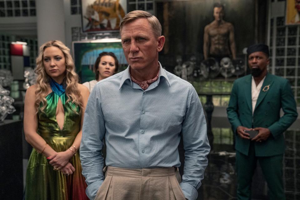 Daniel Craig (center) returns as master sleuth Benoit Blanc while Kate Hudson, Jessica Henwick and Leslie Odom Jr. are among the suspects in the murder mystery sequel "Glass Onion: A Knives Out Mystery."