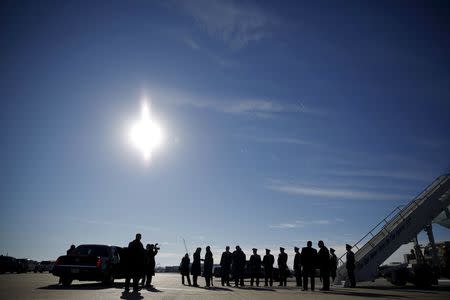 U.S. President Barack Obama (C) shakes hands with a guest as he arrives at Offutt Air Base in Omaha, Nebraska, January 13, 2016. REUTERS/Carlos Barria