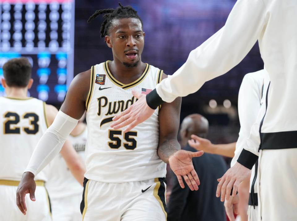 Purdue Boilermakers guard Lance Jones (55) celebrates with teammates during the NCAA MenÃ¢â‚¬â„¢s Basketball Tournament Final Four game against the North Carolina State Wolfpack, Saturday, April 6, 2024, at State Farm Stadium in Glendale, Ariz.