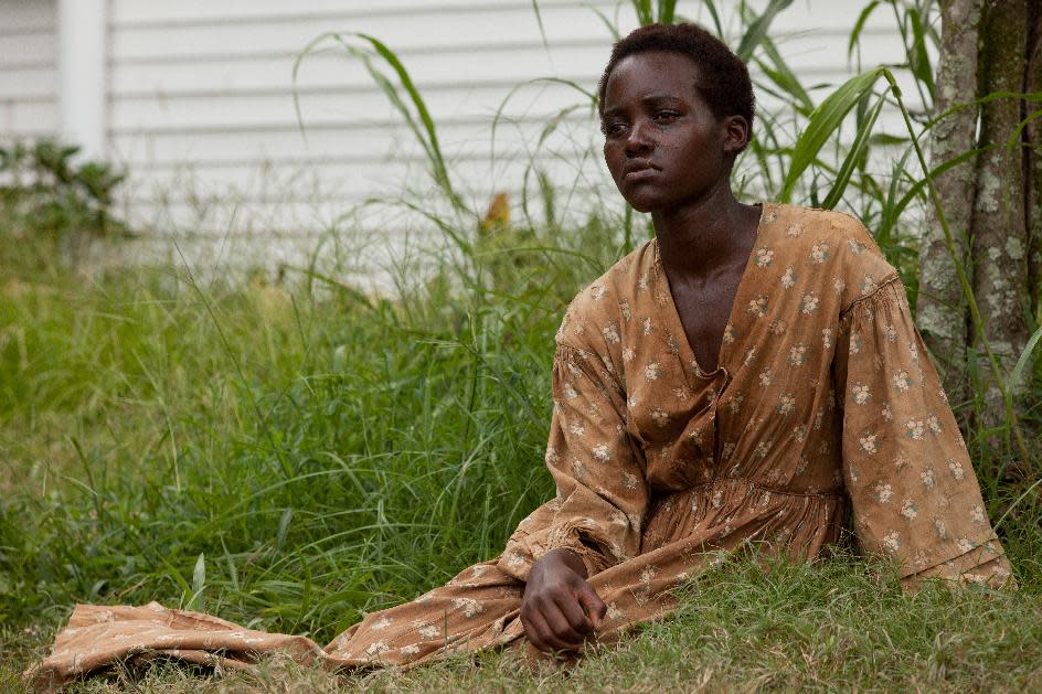 This image released by Fox Searchlight shows Lupita Nyong’o in a scene from "12 Years a Slave." Nyong'o is nominated for an Oscar for her performance by an actress in a supporting role. (AP Photo/Fox Searchlight, Francois Duhamel, file)