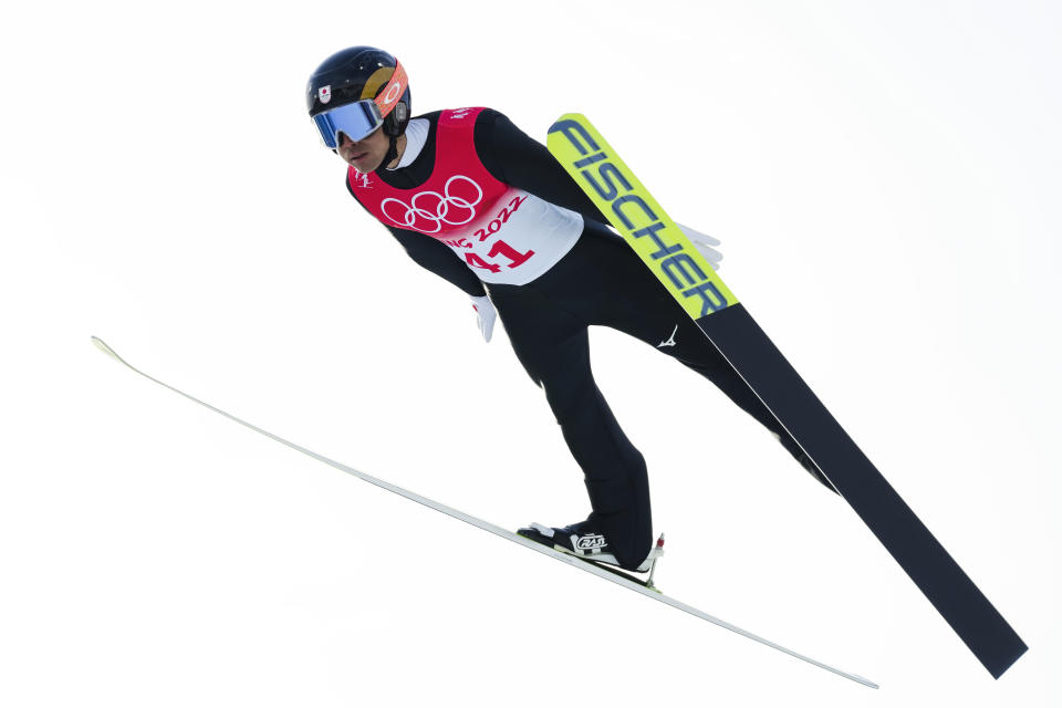 Akito Watabe, of Japan, soars through the air during the trial round of the individual Gundersen large hill/10km ski jumping competition at the 2022 Winter Olympics, Tuesday, Feb. 15, 2022, in Zhangjiakou, China. (AP Photo/Andrew Medichini)