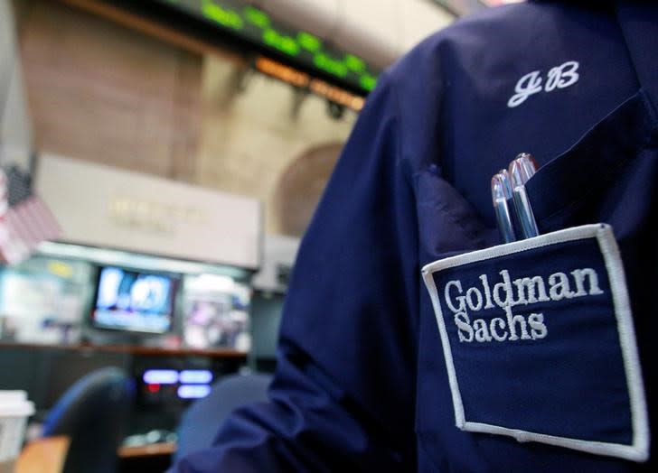 A trader works at the Goldman Sachs stall on the floor of the New York Stock Exchange, April 16, 2012. REUTERS/Brendan McDermid/File Photo