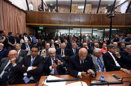 Former Argentine navy officers and other members of Argentina's Naval Mechanics School, known as the ESMA, where the military regime held and tortured thousands of leftists from 1976 to 1983, attend the sentence hearing of the five-year trial for their role during the 1976-1983 dictatorship alongside with their lawyers in Buenos Aires, November 29, 2017. REUTERS/Marcos Brindicci