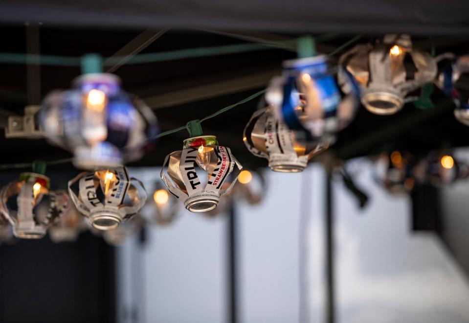 A camper's handmade beverage can light decorations are seen strung up around their canopy in The Resort camping area at Stagecoach at the Empire Polo Club in Indio, Calif., Saturday, April 29, 2023. 