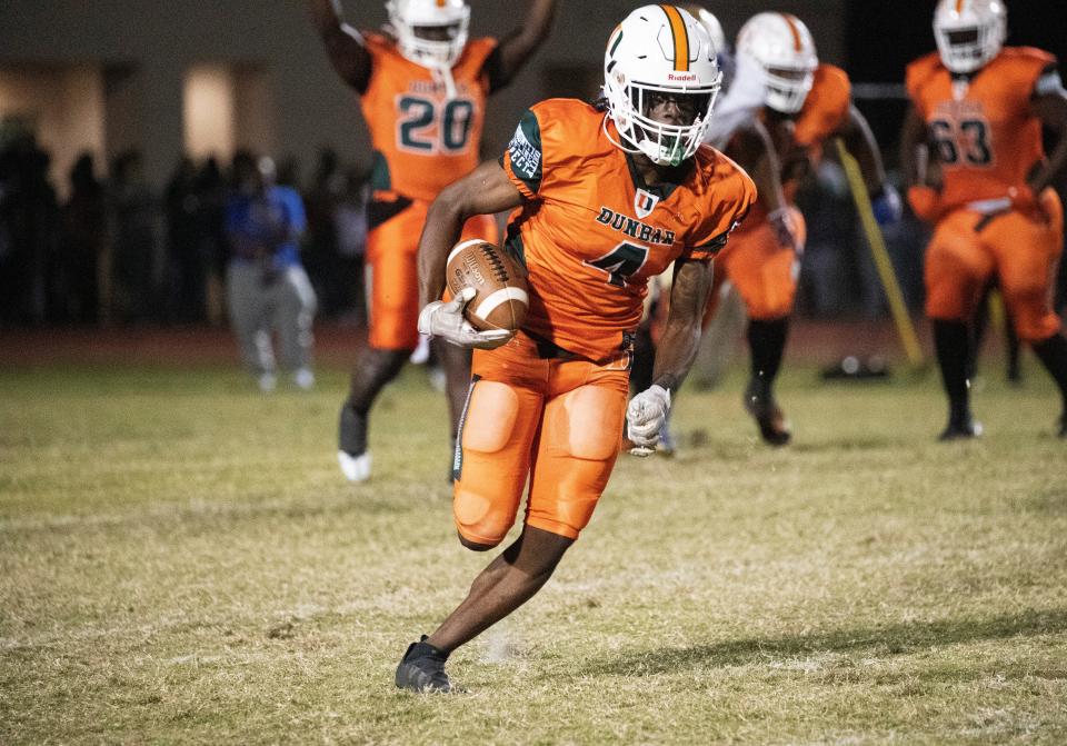 Tawaski Abrams of Dunbar runs toward the end zone to score aa touchdown in the opening drive of the second half against Daytona Beach's Mainland High School in the state football semifinal game on Friday, Dec. 2, 2022, in Fort Myers.