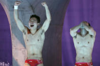 <p>Zongyuan Wang and Siyi Xie of Team China cheer as they win gold during the Men's Synchronized 3m Springboard final at Tokyo Aquatics Centre on July 28.</p>