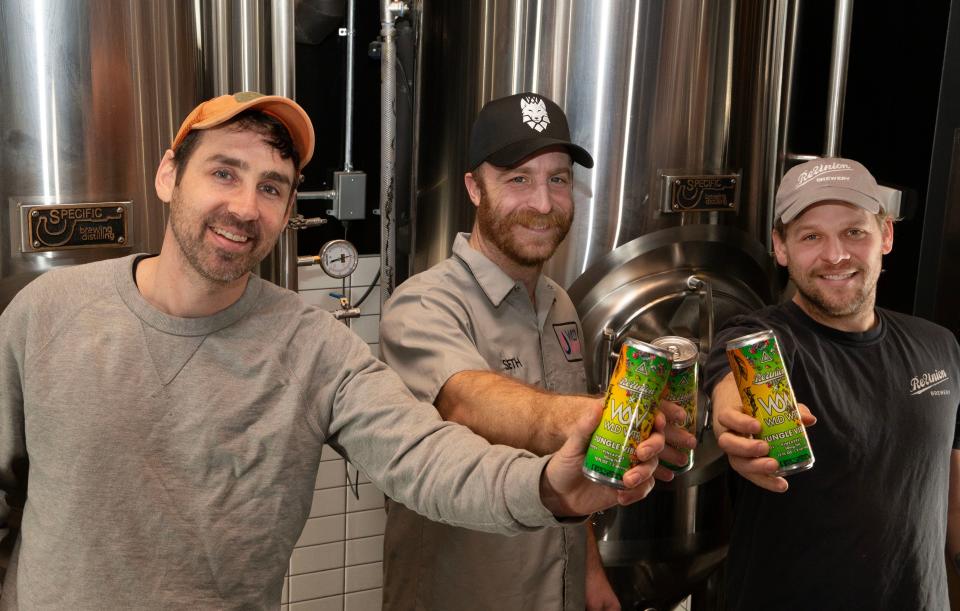 From left, ReUnion brewer Peter Mullaney, WLD WTR Sales Director Seth Groves and ReUnion brewer Logan DePover hold cans of the companies' collaborative THC beverage Monday, Jan. 22, 2024 at ReUnion's downtown Iowa City, Iowa, location.