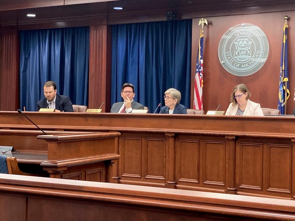 Michigan's Board of State Canvassers, from left, Tony Daunt, Richard Houskamp, Chair Mary Ellen Gurewitz, and Jeannette Bradshaw, considered recall petitions at a meeting in Lansing on Aug. 1, 2023.