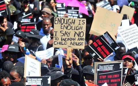 Tens of thousands of South African women have taken to the streets, protesting against the Government’s failure to deal with rising violence against women in the country - Credit: Phill Magakoe/AFP