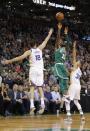 Nov 16, 2017; Boston, MA, USA; Boston Celtics guard Kyrie Irving (11) shoots against Golden State Warriors guard Stephen Curry (30) and forward Omri Casspi (18) in the second half at TD Garden. Mandatory Credit: David Butler II-USA TODAY Sports