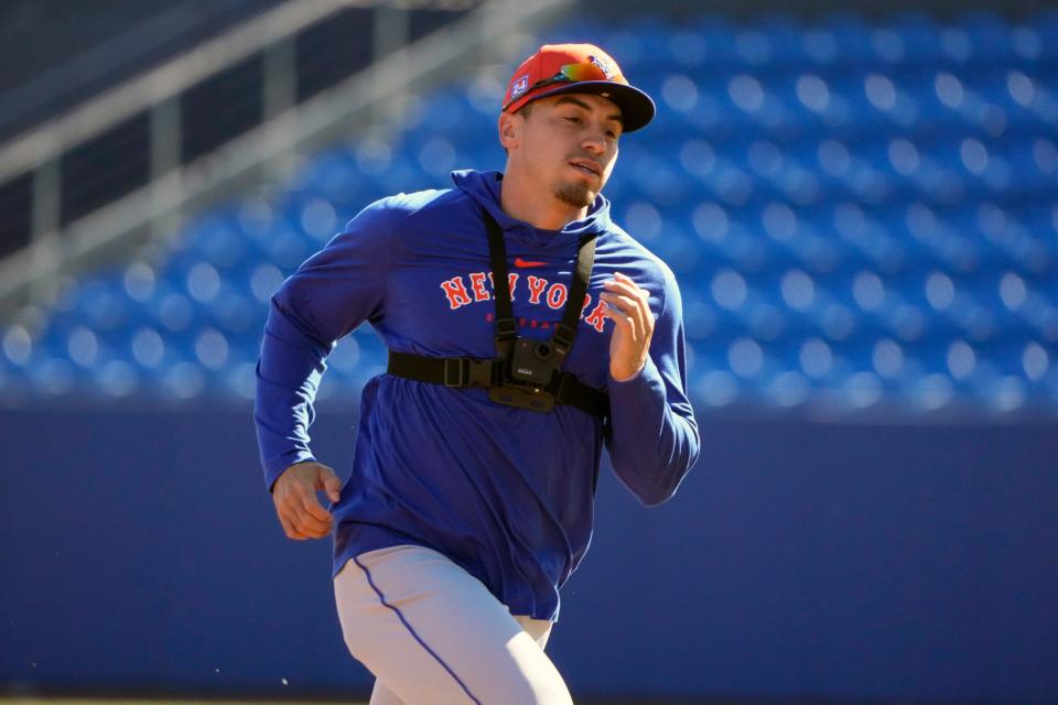 New York Mets' Tyrone Taylor runs the bases during a spring training baseball workout Tuesday, Feb. 20, 2024, in Port St. Lucie, Fla.