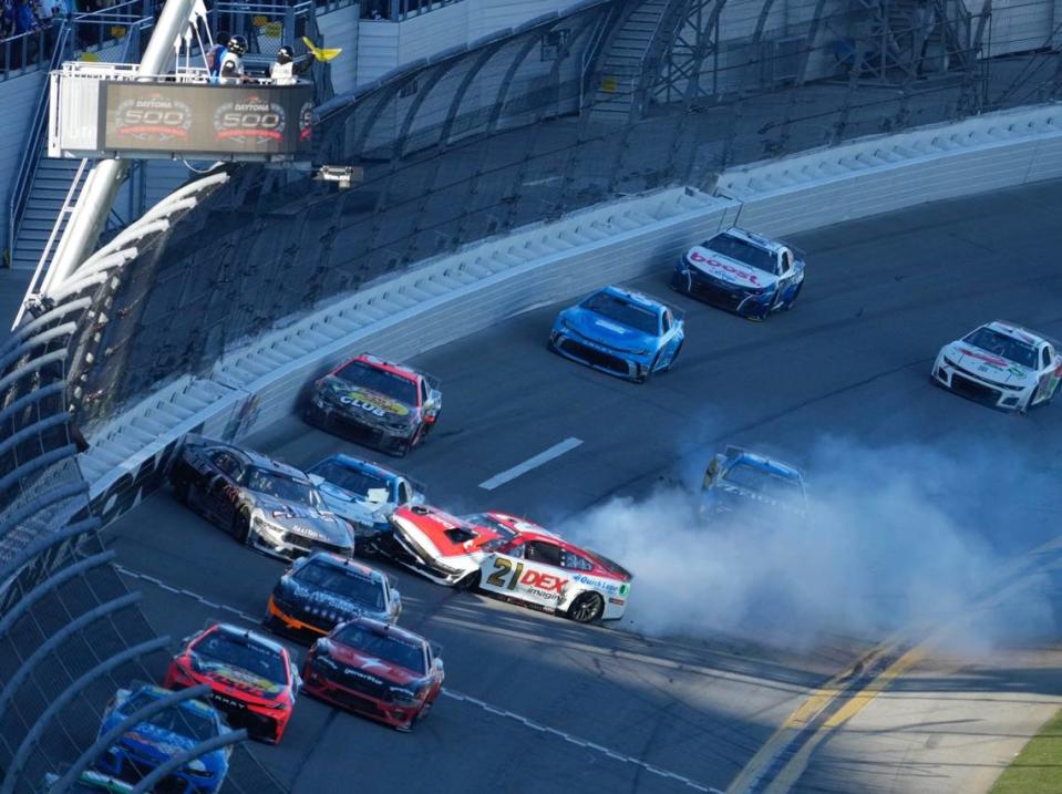 Harrison Burton (21) slides across the front stretch, collecting Ryan Preece (41) and others during an early crash in the Daytona 500, February 19, 2024. Nigel Cook/News-Journal/Nigel Cook/News-Journal / USA TODAY NETWORK