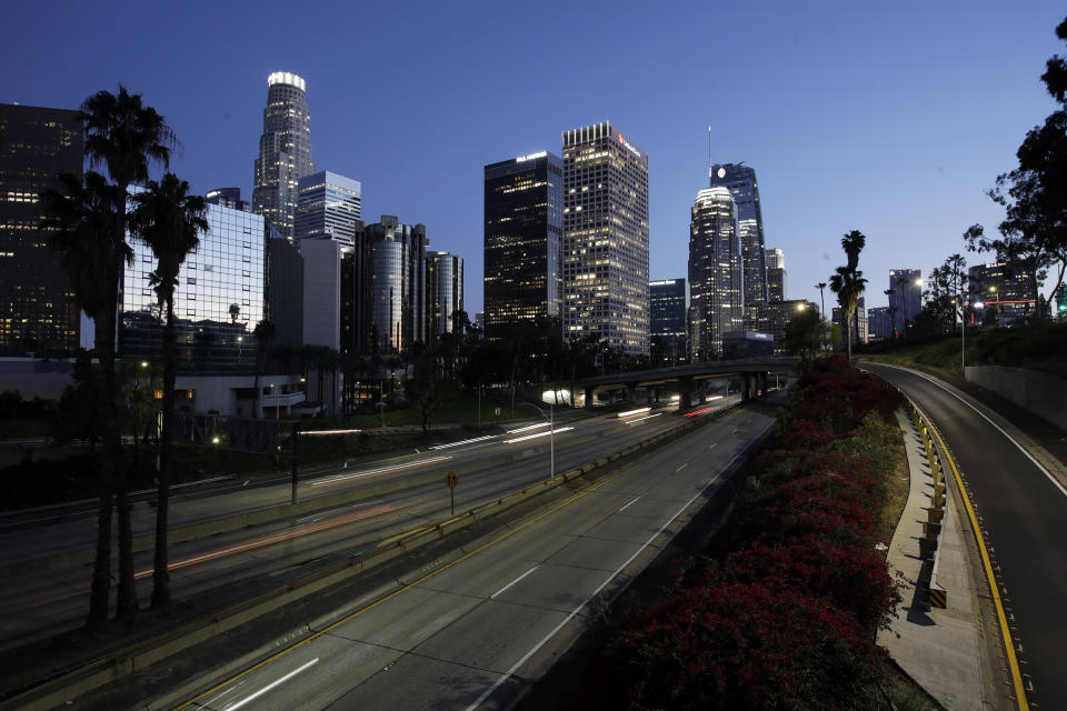 The normally jam-packed California 110 is seen with a light traffic flow Wednesday, April 1, 2020, in Los Angeles. The spread of the coronavirus statewide has, so far, been slow enough to give the state time to prepare for an expected spike in cases that could overwhelm hospitals if extreme measures aren't taken to keep most people home and away from others. (AP Photo/Marcio Jose Sanchez)