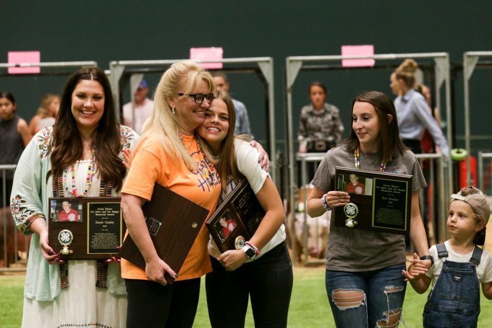 Tamara House embraces an "I'm Alive and I'm Happy Memorial Award" winner at the Tippecanoe County 4-H Fair, Sunday, July 18, 2021 in Lafayette.