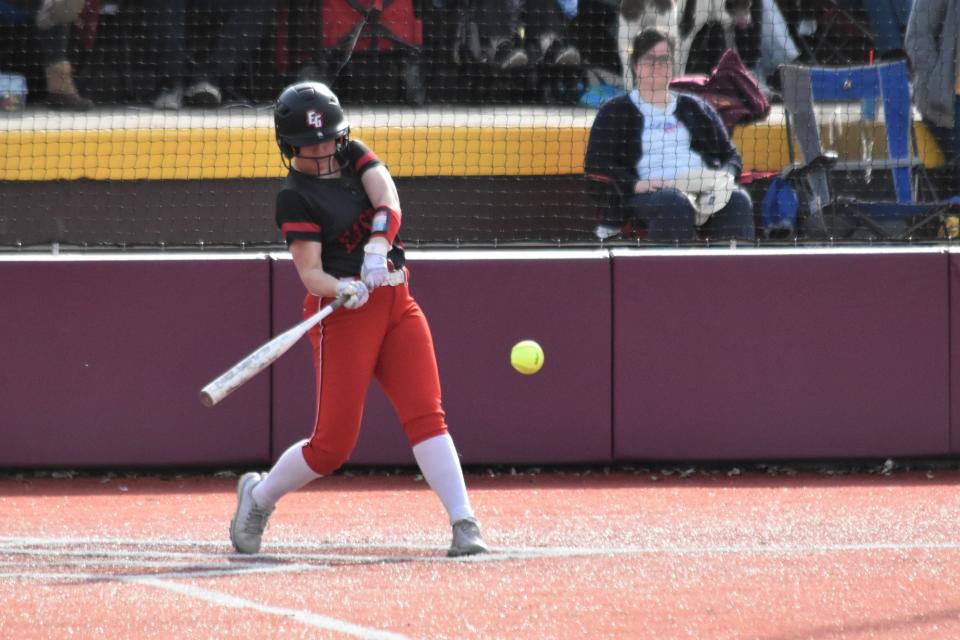 Indy Workman takes a hack at a pitch against Bloomington North.