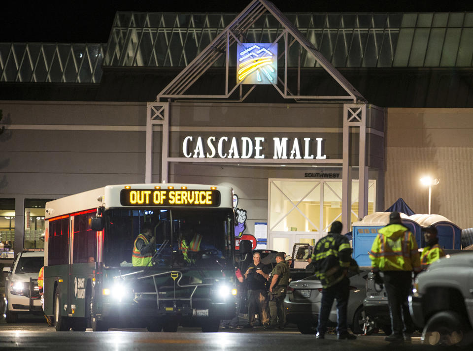 <p>Emergency personnel stand in front of an entrance to the Cascade Mall at the scene of a shooting where several people were killed Friday, Sept. 23, 2016, in Burlington, Wash. Police searched Saturday for a gunman who opened fire in the makeup department of a Macy’s store at the mall north of Seattle, killing several females, before fleeing toward an interstate on foot, authorities said. (AP Photo/Stephen Brashear) </p>