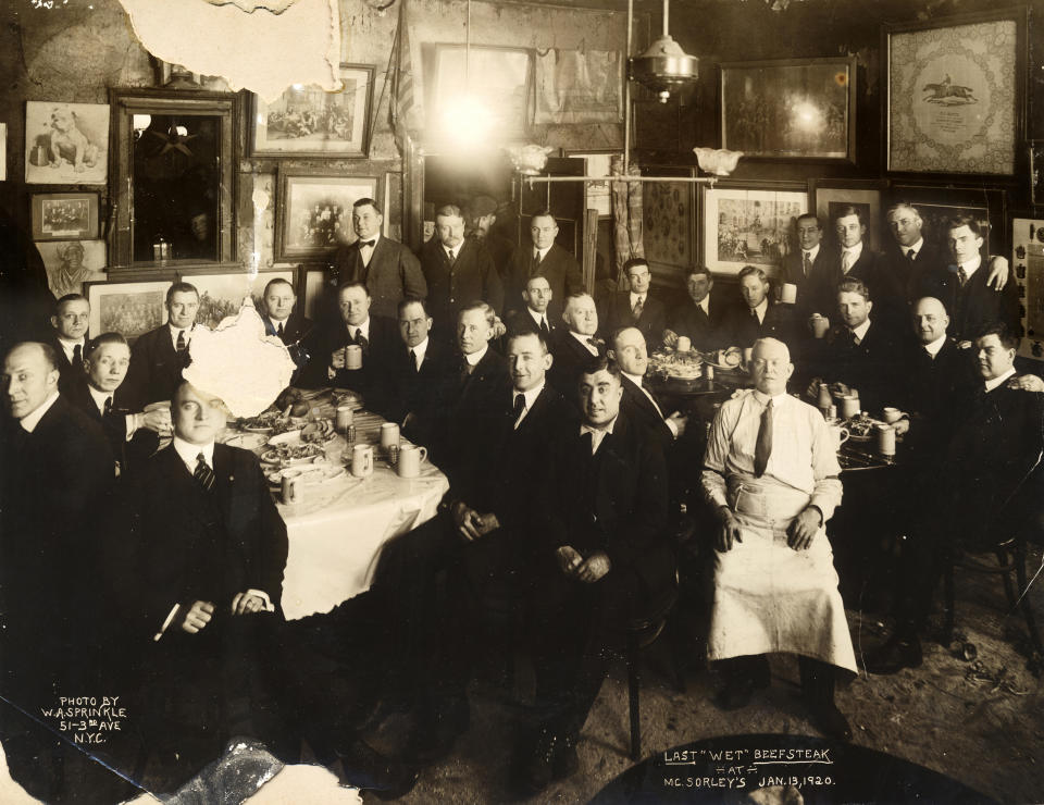 In this Jan. 13, 1920 photo provided by McSorley's Old Ale House, clients and staff pose in the New York bar shortly before the beginning of Prohibition. Located in Manhattan's Lower East Side, McSorley's opened in the mid-19th century, functioned as a speakeasy during Prohibition, and continues in operation today. (W.A. Sprinkle/McSorley's Old Ale House via AP)