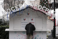 A man stands in front of a closed small shop called "Moscow - Belgrade", on the main pedestrian street in downtown Belgrade, Serbia, Monday, Jan. 16, 2023. Since the start of the war in Ukraine, about 200,000 Russians have left their homeland for Serbia, with many seeking a new life in a fraternal Slavic country free from Kremlin oppression. The Balkan country is a close ally of Moscow, with historic, religious and cultural ties, and Russia backs Serbia’s claim over its former province of Kosovo.(AP Photo/Darko Vojinovic)