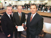 FILE - In this April 10, 1998, file photo, from right, British Prime Minister Tony Blair, U.S. Sen. George Mitchell, and Irish Prime Minister Bertie Ahern, pose together after they signed the Good Friday Agreement for peace in Northern Ireland. Fears about a return to the violence that killed more than 3,500 people over three decades have made Northern Ireland the biggest hurdle for U.K. and EU officials who are trying to hammer out a Brexit divorce deal. (AP Photo/File)