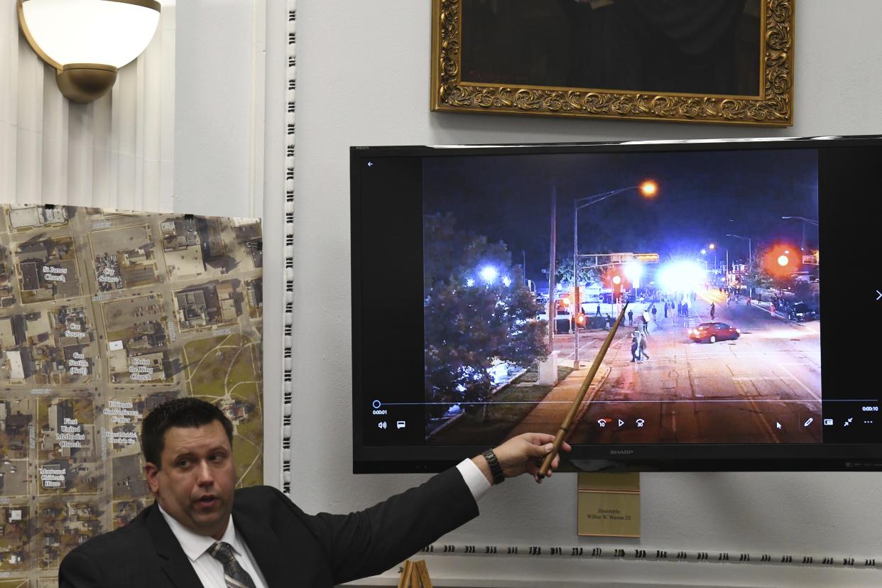 James Armstrong, of the state crime lab, points to drone video he digitally enlarged during Kyle Rittenhouse's trial at the Kenosha County Courthouse in Kenosha, Wis., on Tuesday, Nov. 9, 2021. Rittenhouse is accused of killing two people and wounding a third during a protest over police brutality in Kenosha, last year. (Mark Hertzberg/Pool Photo via AP)