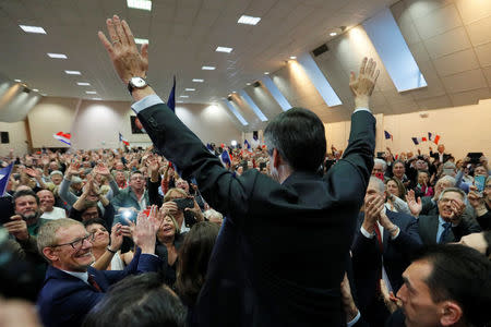 Francois Fillon, former French prime minister, member of the Republicans political party and 2017 presidential election candidate of the French centre-right, waves at supporters as he arrives at a campaign rally in Pertuis, France, March 15, 2017. REUTERS/Charles Platiau