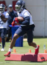 Tennessee Titans running back Derrick Henry runs through a drill during NFL football minicamp practice Tuesday, June 15, 2021, in Nashville, Tenn. (George Walker IV/The Tennessean via AP, Pool)