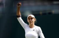 Ukraine's Lesia Tsurenko celebrates beating Britain's Jodie Burrage in a women's singles first round match on day one of the Wimbledon tennis championships in London, Monday, June 27, 2022. (Steve Paston/PA via AP)