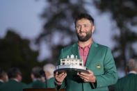 Jon Rahm, of Spain, holds up the trophy after winning the Masters golf tournament at Augusta National Golf Club on Sunday, April 9, 2023, in Augusta, Ga. (AP Photo/David J. Phillip)