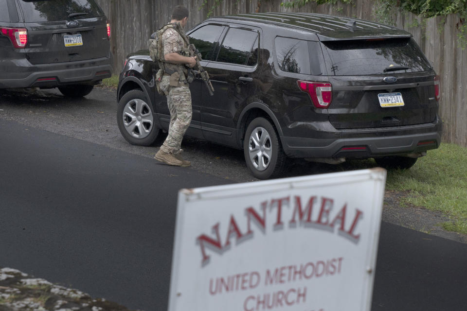 PA State Troopers and other law enforcement officers are on the scene in Nantmeal Village as the search for escaped convict Danelo Cavalcante moved to northern Chester County Sunday, Sept. 10, 2023. (Tom Gralish/The Philadelphia Inquirer via AP)