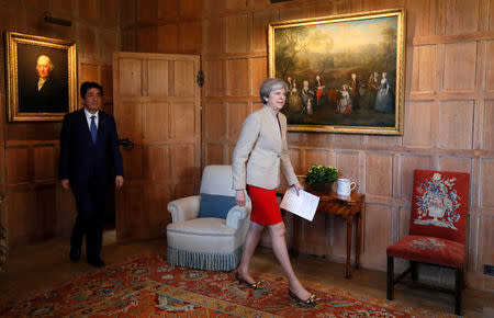 Britain's Prime Minister Theresa May and Prime Minister Shinzo Abe of Japan arrive for a joint news conference at Chequers, near Wendover, Britain April 28, 2017. REUTERS/Kirsty Wigglesworth/Pool