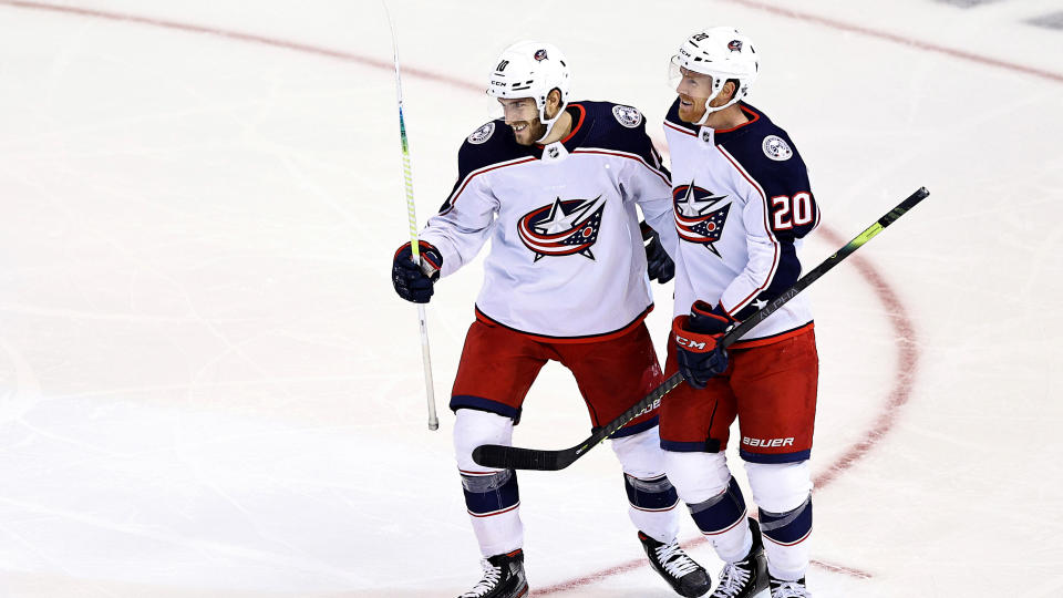 TORONTO, ONTARIO - AUGUST 13:  Alexander Wennberg #10 of the Columbus Blue Jackets is congratulated by his teammate, Riley Nash #20 after scoring a goal against the Tampa Bay Lightning during the third period in Game Two of the Eastern Conference First Round during the 2020 NHL Stanley Cup Playoffs at Scotiabank Arena on August 13, 2020 in Toronto, Ontario. (Photo by Elsa/Getty Images)