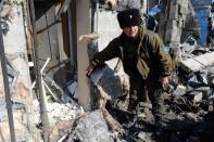 A pro-Russian separatist shows a disguised explosive device in the eastern city of Debaltseve, on February 27, 2015