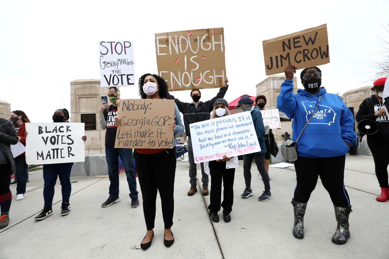 Protesters gather outside of the Georgia State Capitol in Atlanta to protest HB 531, which would place tougher restrictions on voting in Georgia, U.S. March 1, 2021. REUTERS/Dustin Chambers     TPX IMAGES OF THE DAY